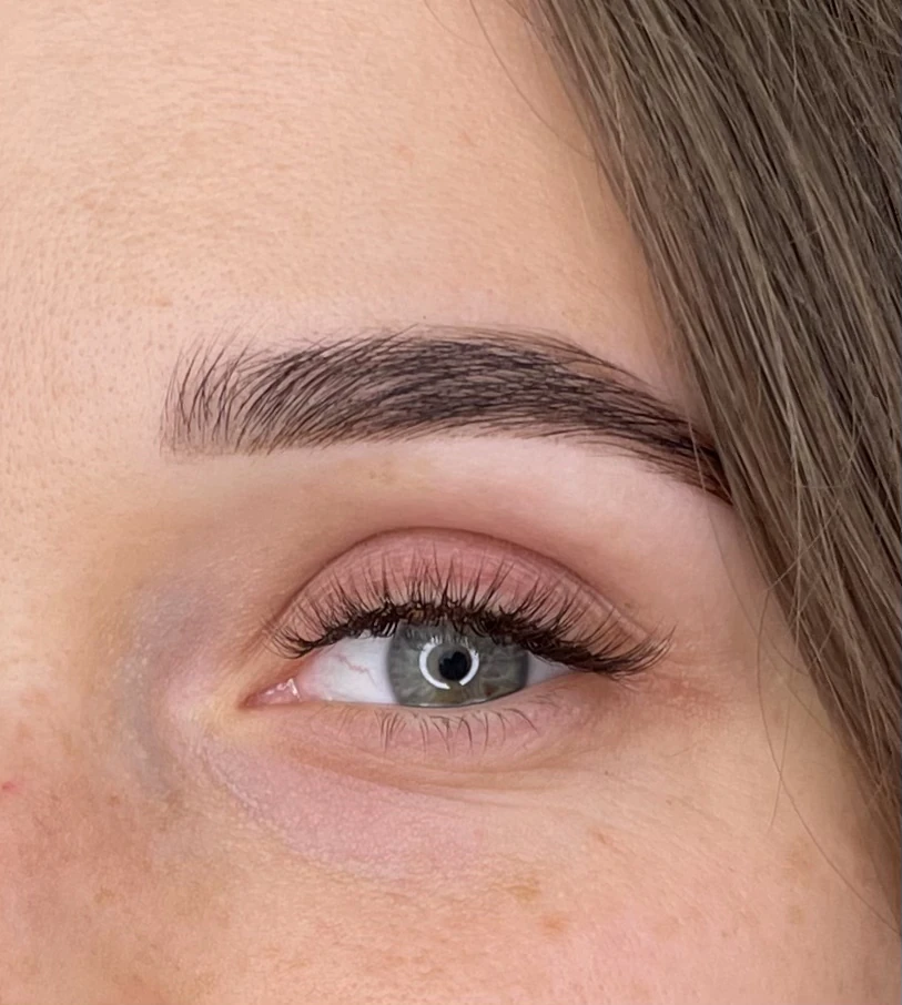 Classic lash extensions with outer-corner length and a groomed brow arch on blue-grey eyes at My Beauty Space Mississauga.