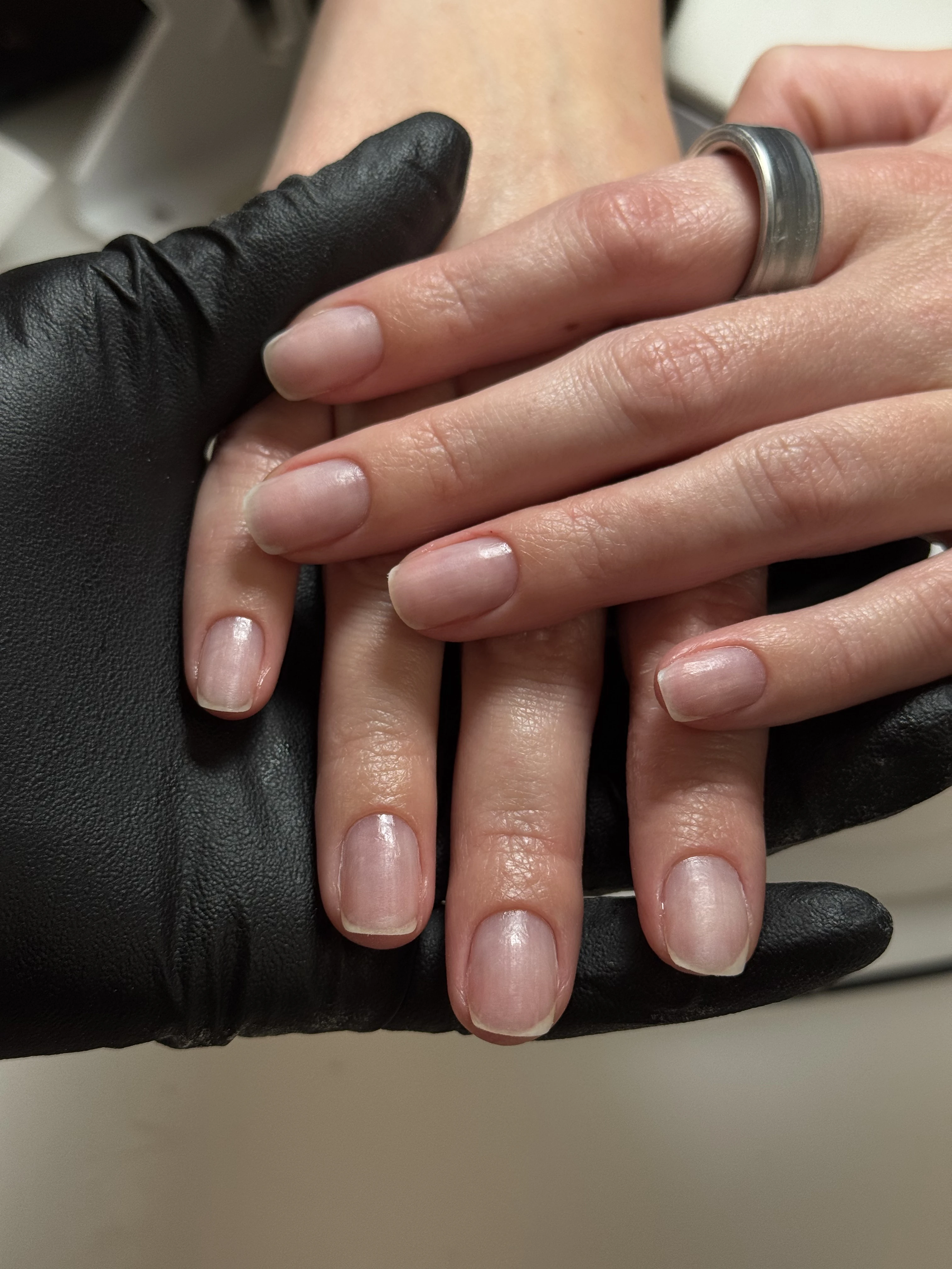 Neat squoval natural nails without color polish, supported by a technician at My Beauty Space no-polish manicure Mississauga.